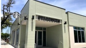 A Starbucks store with a modern design, featuring a flat roof and large windows. - 11NOLA Living In The Heart Of Many Attractions  (New Orleans)