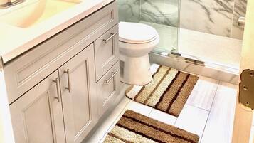 Shower, towels, soap, toilet paper