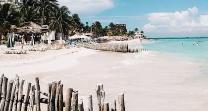 The Sol Studio Suite with balcony overlooking the pool and garden area