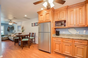 Enjoy cooking in the well-appointed kitchen with a dining area perfect for meals.
