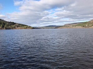 A calm lake with forested hills in the background. - Amazing Mattawa Riverfront, Mountain View Home, Close to Adventures & Amenities (Mattawa)