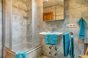 Shower, hair dryer, towels