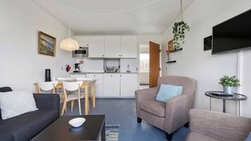 Apartment | Living area | 30-inch TV with digital channels