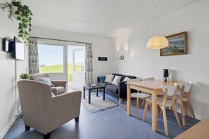 Apartment | Living area | 30-inch TV with digital channels - Cozy Brenderup Apartment on the Beach (Middelfart)