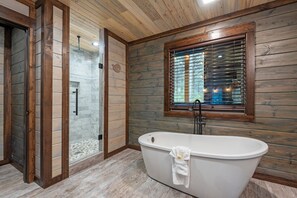 Bathtub, hair dryer, towels, soap