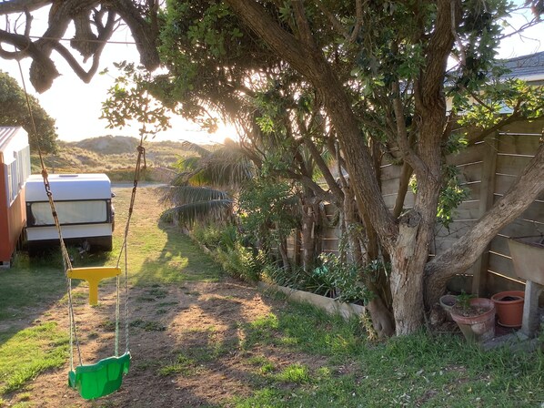 Property grounds - One bedroom unit, over the dunes to the beach (Te Kopuru)