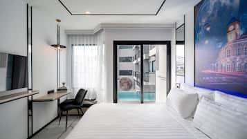 Habitación Deluxe, acceso a la alberca | Artículos del minibar gratis y caja de seguridad en la habitación