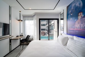 Deluxe Room, Pool Access | Free minibar items, in-room safe, desk, blackout drapes - Ratri Hotel Phuket Old Town (Phuket)