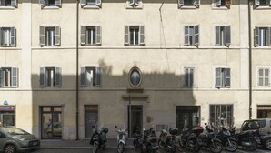 A building with multiple windows and a central entrance.
