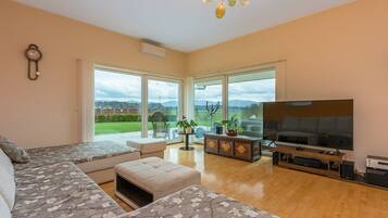 Family Villa, Multiple Beds, Refrigerator & Microwave (Pool Villa Ana Residence) | Living area | 21-inch Smart TV with digital channels, TV, fireplace