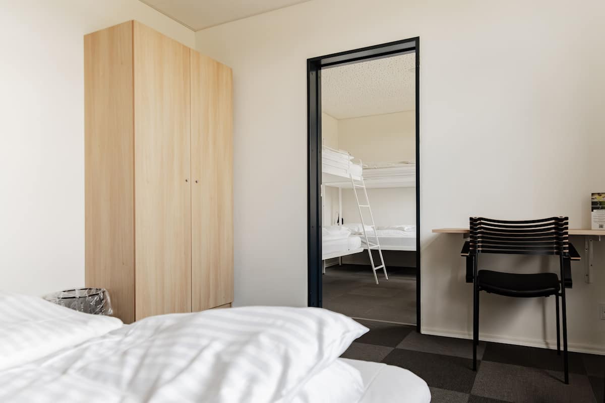 family room | 2 bedrooms, individually decorated, desk, soundproofing