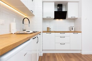 Apartment, 1 Bedroom, Balcony | Private kitchenette | Dishwasher, electric kettle, high chair, cookware/dishes/utensils - Apartment Starowiejska Gdansk by Renters (Gdansk)