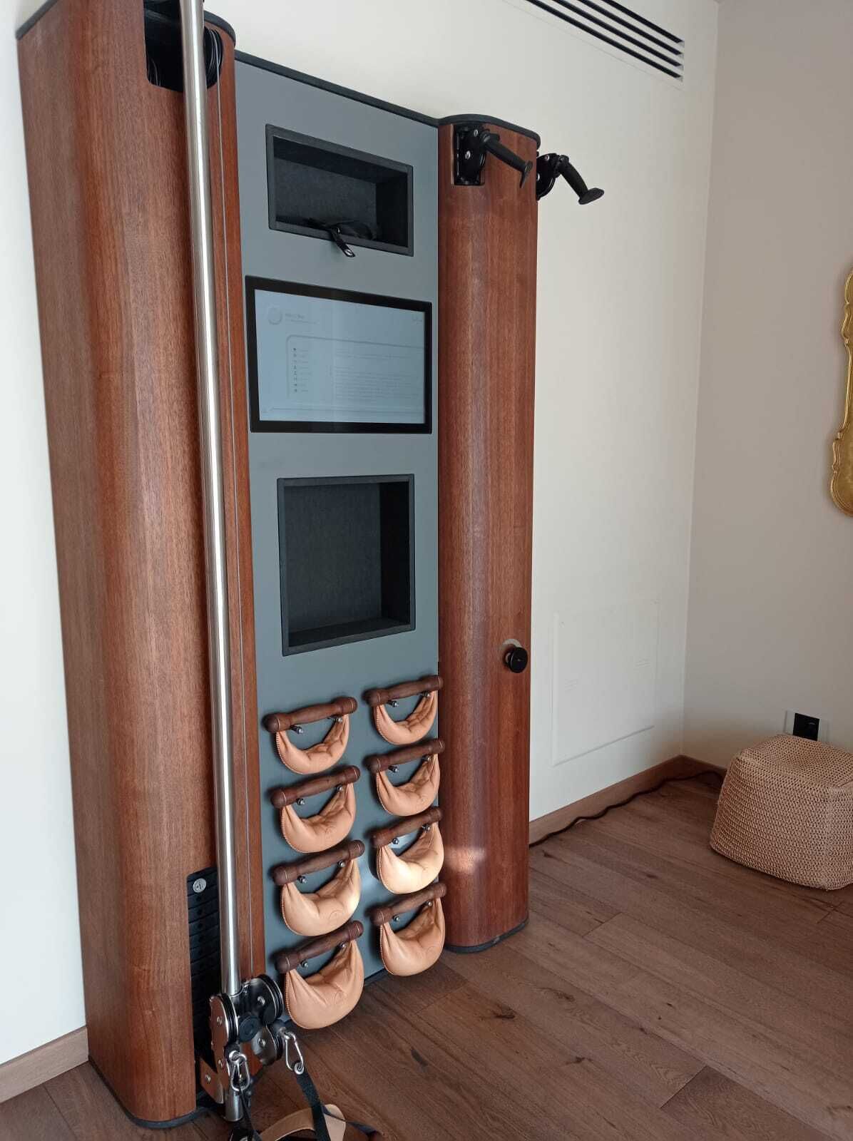 A wooden door with a vertical handle and a small window.