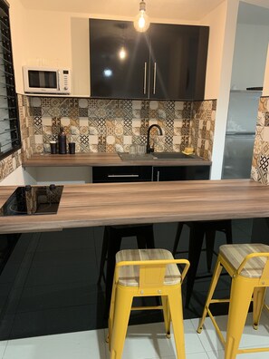 Fridge, microwave, stovetop, coffee/tea maker