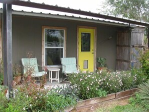 Enjoy a peaceful retreat in this charming single-story building with an entrance and cozy porch area.