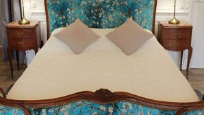 A bed with a floral headboard, two bedside tables, and a lamp on each side. - JOSEPHINE BEDROOM  (Luxeuil-les-Bains)