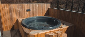 Cottage w/ heated Aurora Igloo, Hot tub, & private covered patio.