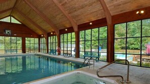 An indoor swimming pool with a separate hot tub area, large windows, and benches. - King Ensuite+Resort Access 1.5m+Waterfalls/hiking (Sapphire)