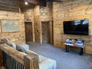 Smart TV, fireplace, books, printers