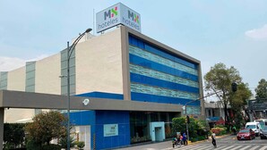 A modern hotel building with a prominent 'MX hotels' sign, a blue facade, and a visible entrance. - Hotel MX forum buenavista CDMX, Trademark by Wyndham (Mexico City)