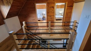 A wooden interior with a staircase leading to a bedroom. - Anemona House - Plitvice Lakes - 500 m  from  Big Waterfall (Plitvice Lakes)