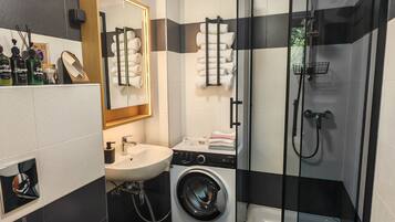Bathtub, hair dryer, towels, soap
