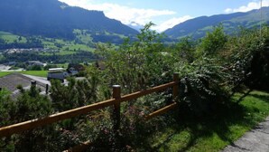 A scenic view of a mountainous landscape with a wooden fence in the foreground. - Wohnung Nr.2 by Interhome (Schluein)