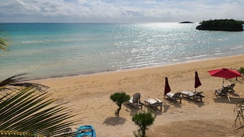 On the beach, sun loungers, beach towels