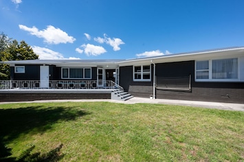 Large fully fenced yard with north facing deck