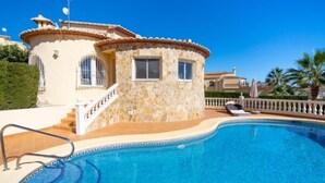 A stone building with a pool, a staircase, and a railing. - Kalmias by Interhome (Moraira)