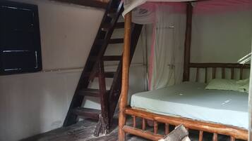 A room with a wooden ladder, a bed with a pink canopy, a window, and a wooden floor.
