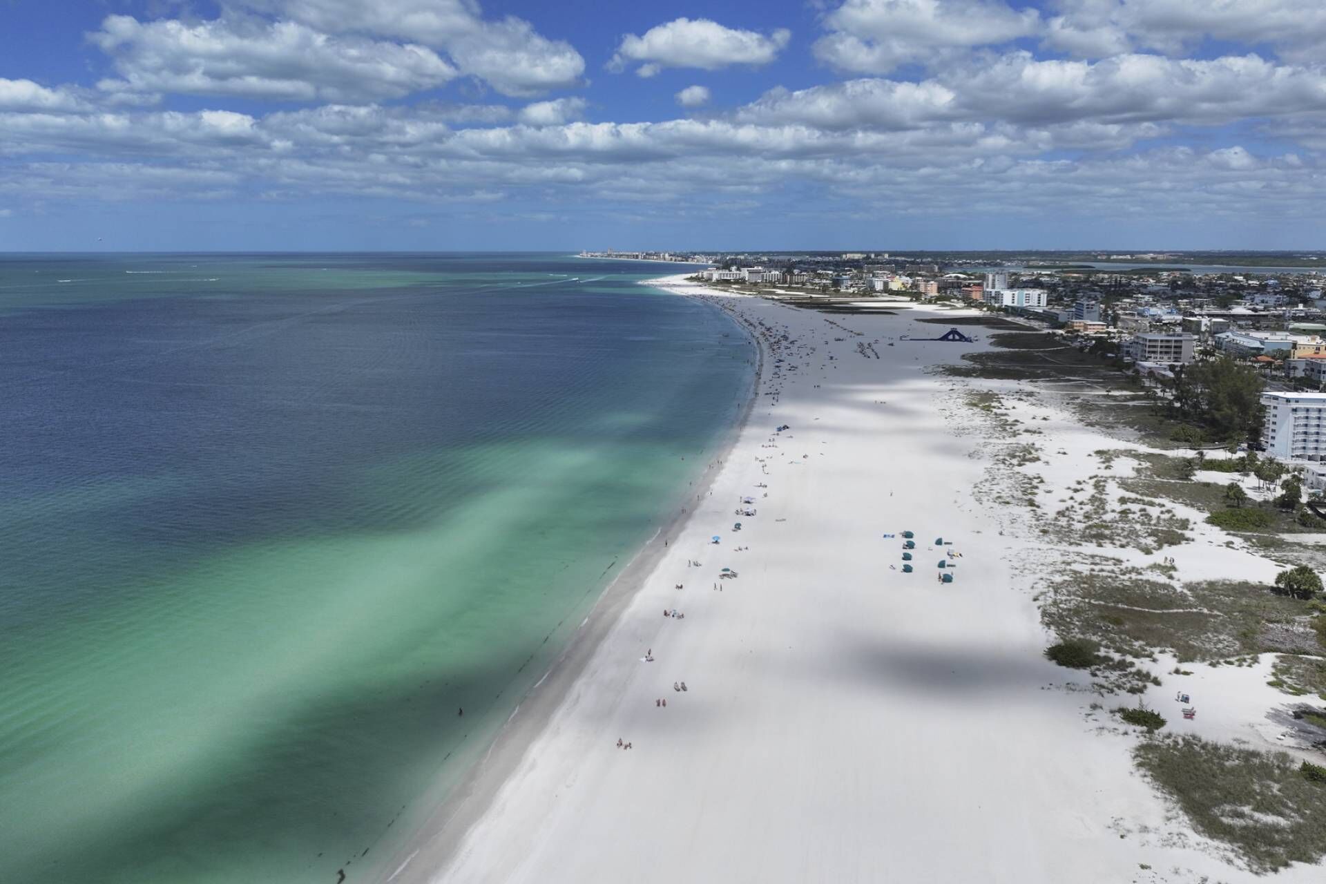 On the beach, beach towels, motor boating