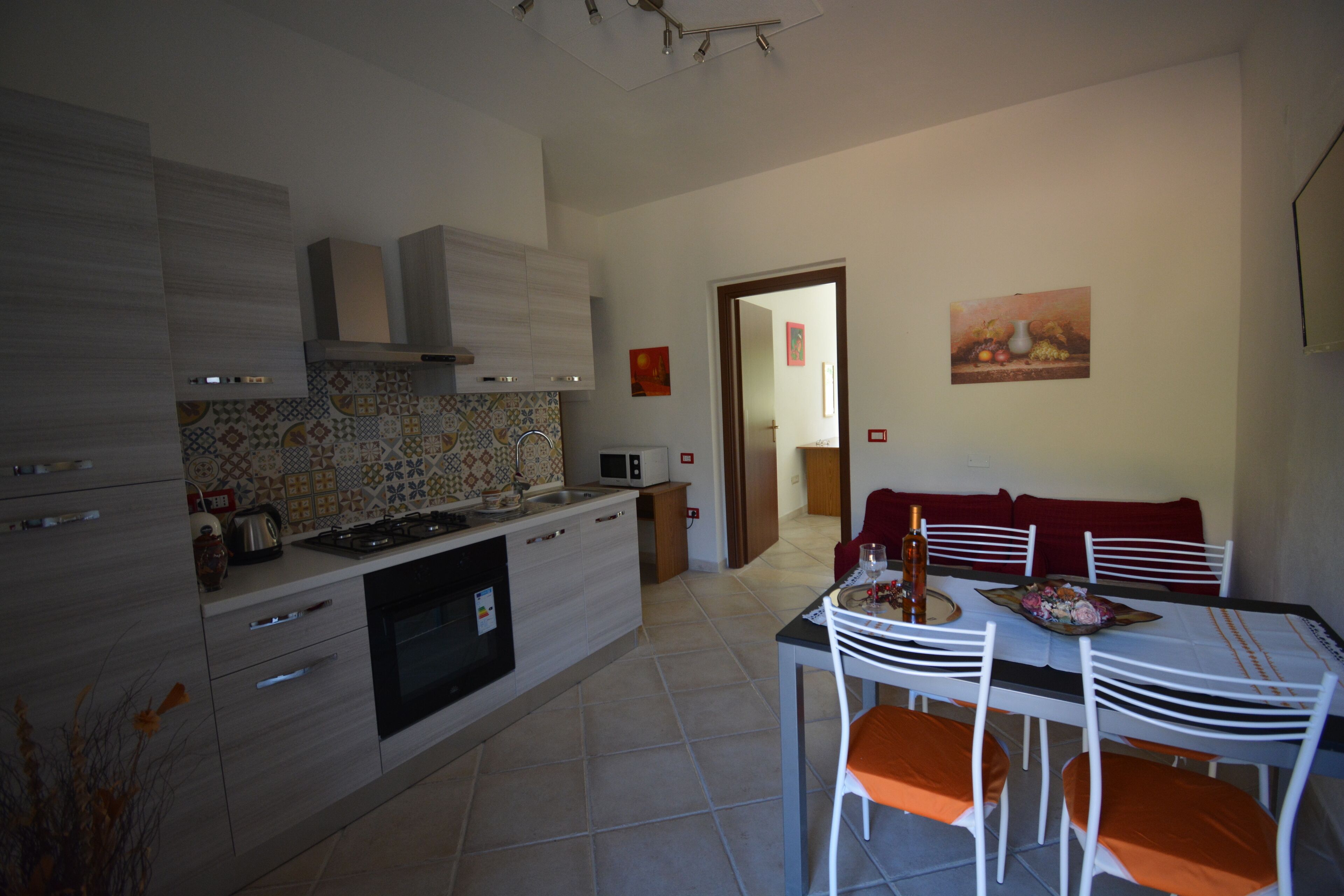 A modern kitchen with a dining area.