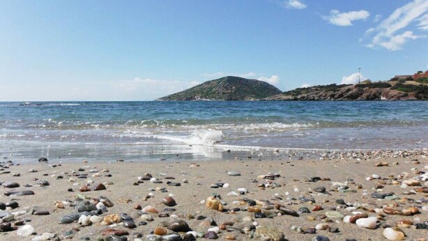 A beach with pebbles and a distant island. - Harmony Vale- Anavissos (Saronikos)