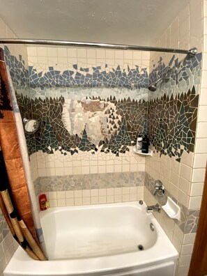 Combined shower/bathtub, hair dryer, towels, soap