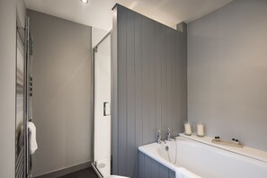 Bathtub, hair dryer, towels, soap