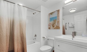 Combined shower/bathtub, hair dryer, towels, toilet paper
