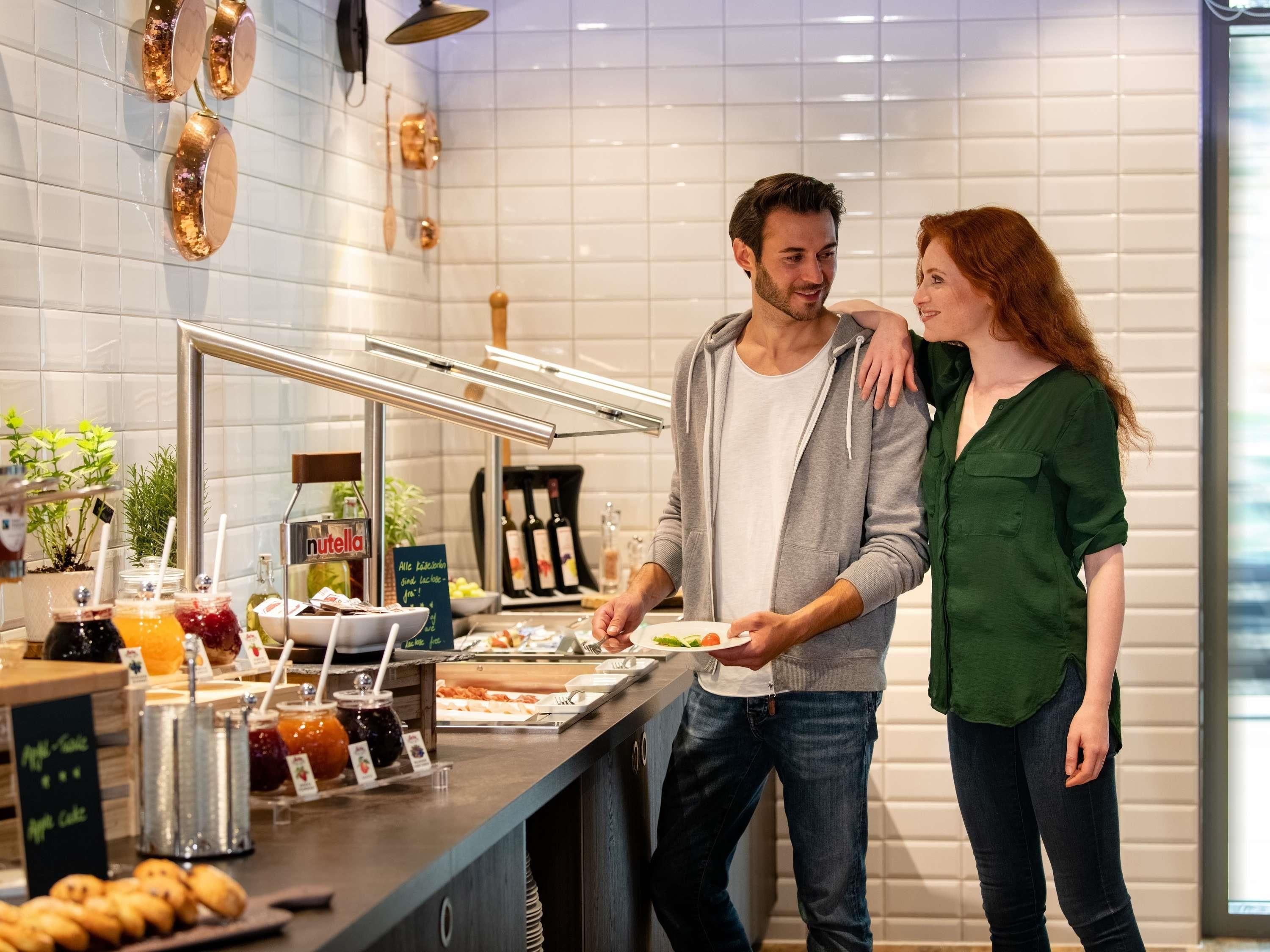 A buffet area with a variety of food items and a Nutella display.