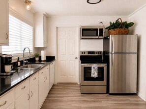 Coffee/tea maker, fridge, microwave, oven
