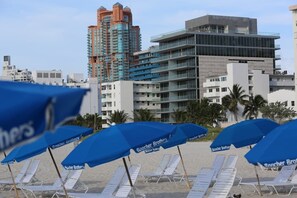 On the beach, sun loungers, beach towels