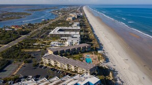 A coastal hotel with multiple buildings, a beach, and a marina. - Coquina A203- Steps to the Beach (Saint Augustine)