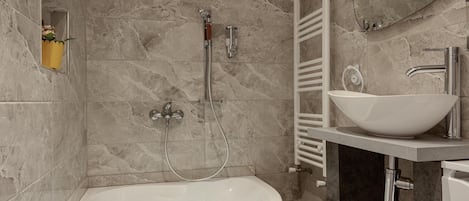 Bathtub, hair dryer, towels, soap
