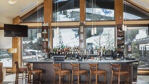 A bar area with a view of a snowy mountain landscape through large windows. - ⭐️New Listing ⭐️ At Purg Base ⎮Free WIFI + Fireplace (Durango)