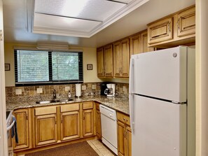 Fridge, microwave, oven, stovetop - 203 Sea Woods 2BR - Comfort Meets Coast (New Smyrna Beach)