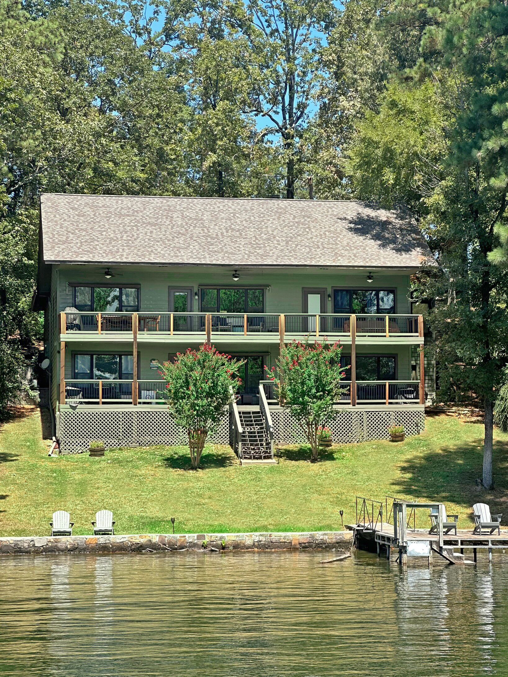 Two decks extend length of home with multiple seating options available.