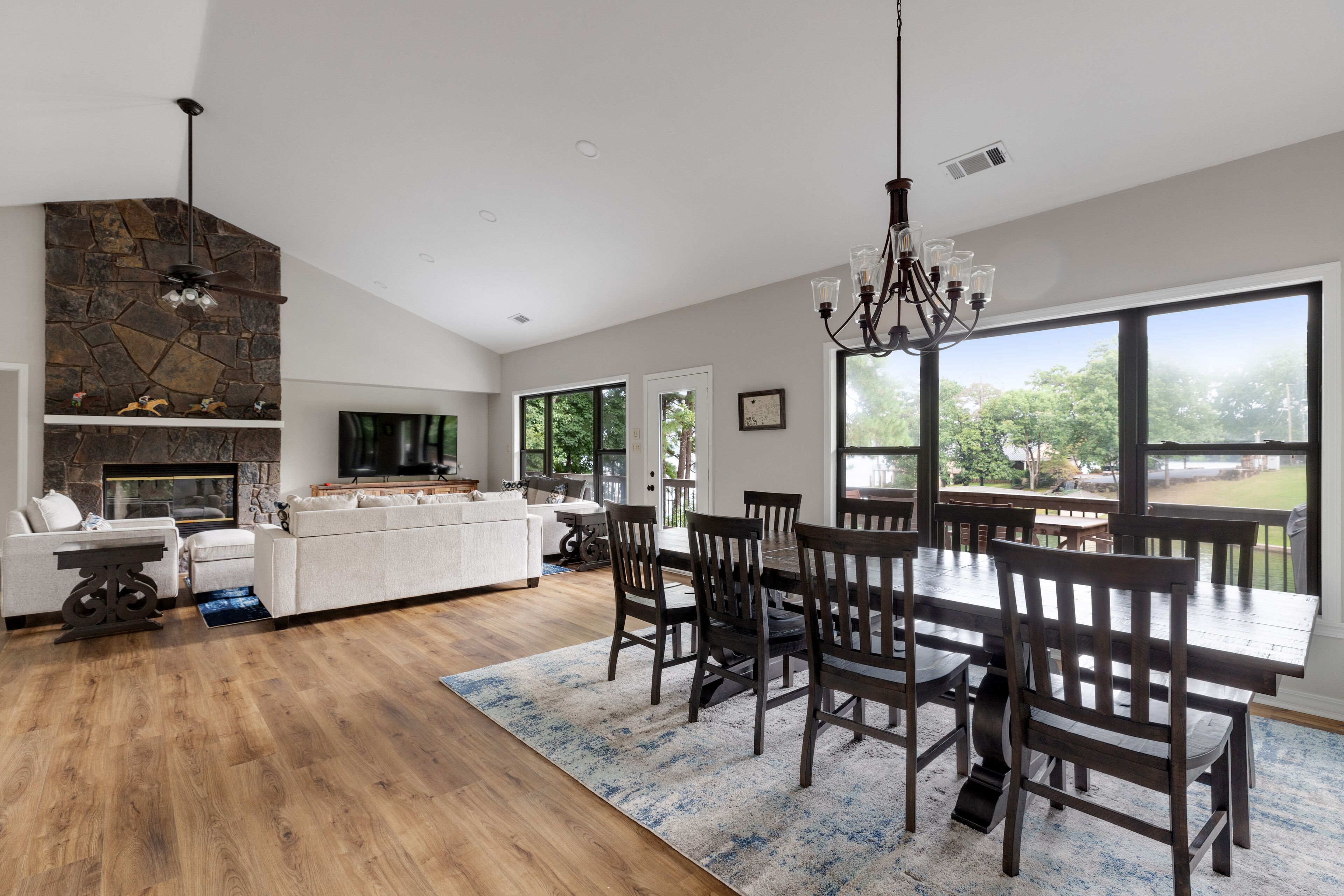 Lake views from all areas of upper living, dining space, and kitchen.