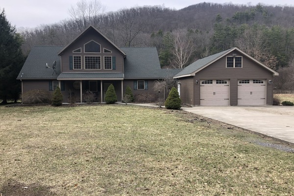 Front view of home. The Pine Creek Rail Trail borders the front.