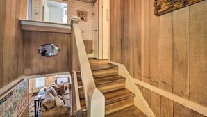 A wooden staircase with a white handrail leading to a second-floor area. A sign above the staircase reads "MEADOWS TRAIL." - < 1 Mi to Beech Mtn Ski! Condo w/ Hot Tub Access (Beech Mountain)