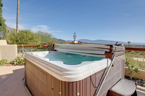 Relax on the balcony with a hot tub overlooking the scenic mountains.
