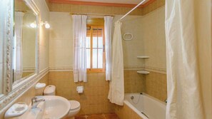 Bathtub, hair dryer, towels